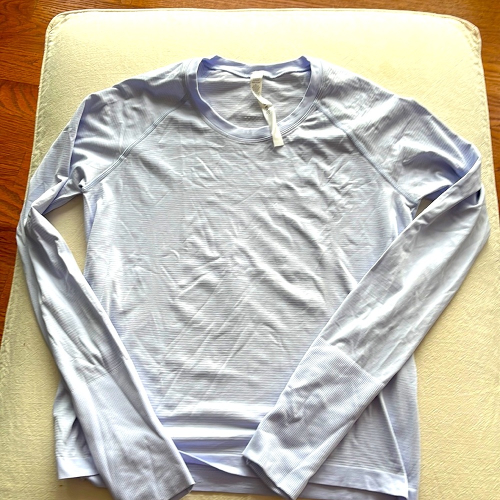 Lulu lemon shirt . Lilac never worn size 10